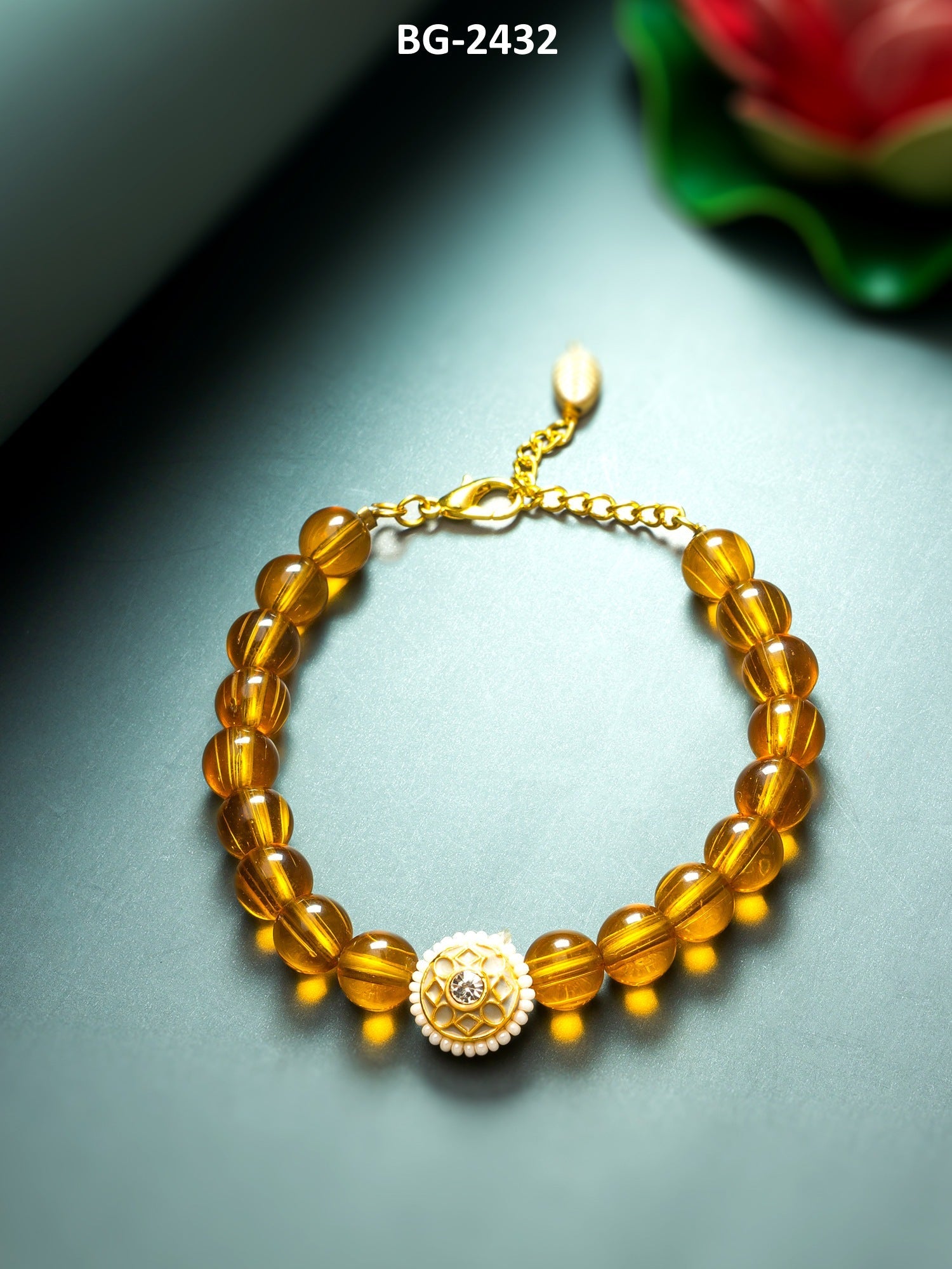 Orange and gold-toned link bracelet