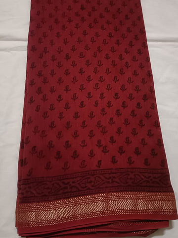 Traditional motifs on Red with zari Border