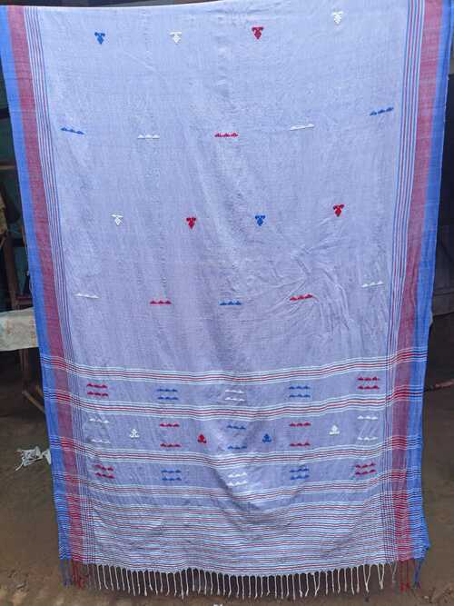 Light blue color with white & red butis all over with a contrast maroon & dark blue plain border & pallu