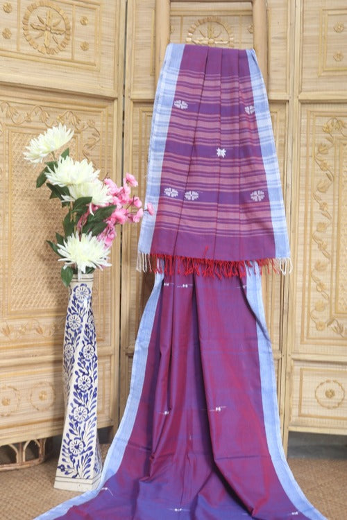 A beautiful Mauve with white butis all over with a contrast white plain border and Pallu - Sarikart Online