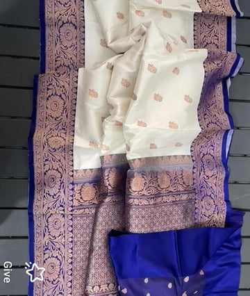 Gorgeous White large buta katan silk with contrast Royal Blue intricate zari woven large border and Pallu